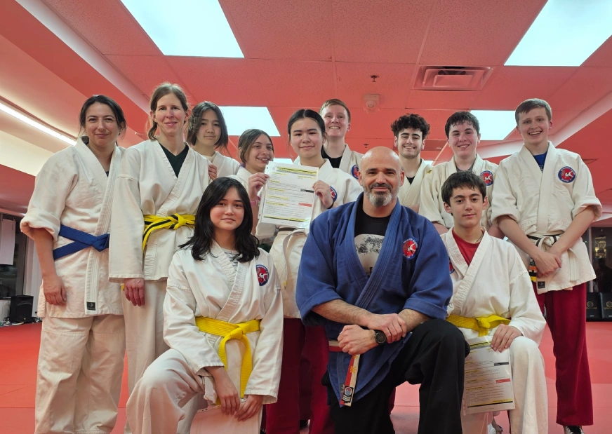 Happy kids in MetroWest learning martial arts, improving balance, coordination, and having fun while building life skills.